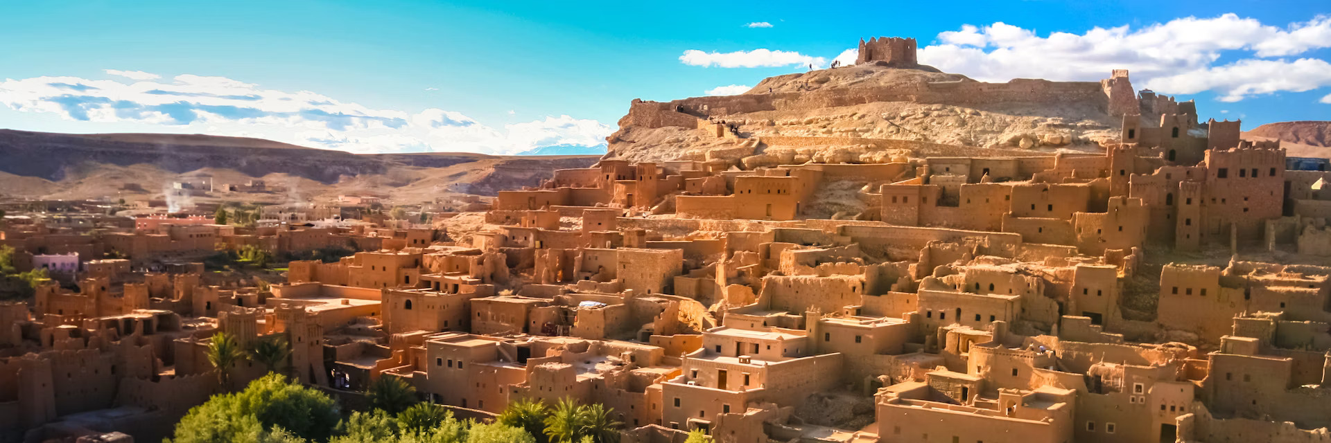 View of Ait Benhaddou, a historic Kasbah in Morocco, showcasing its distinctive earthen architecture and ancient cityscape.