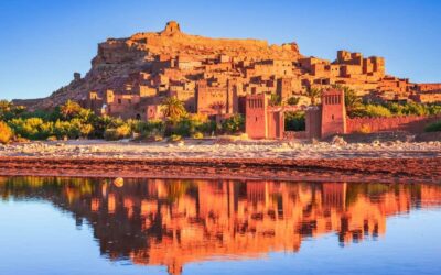 Ait Ben Haddou kasbah at sunset with reflections in the water, UNESCO World Heritage site in Morocco