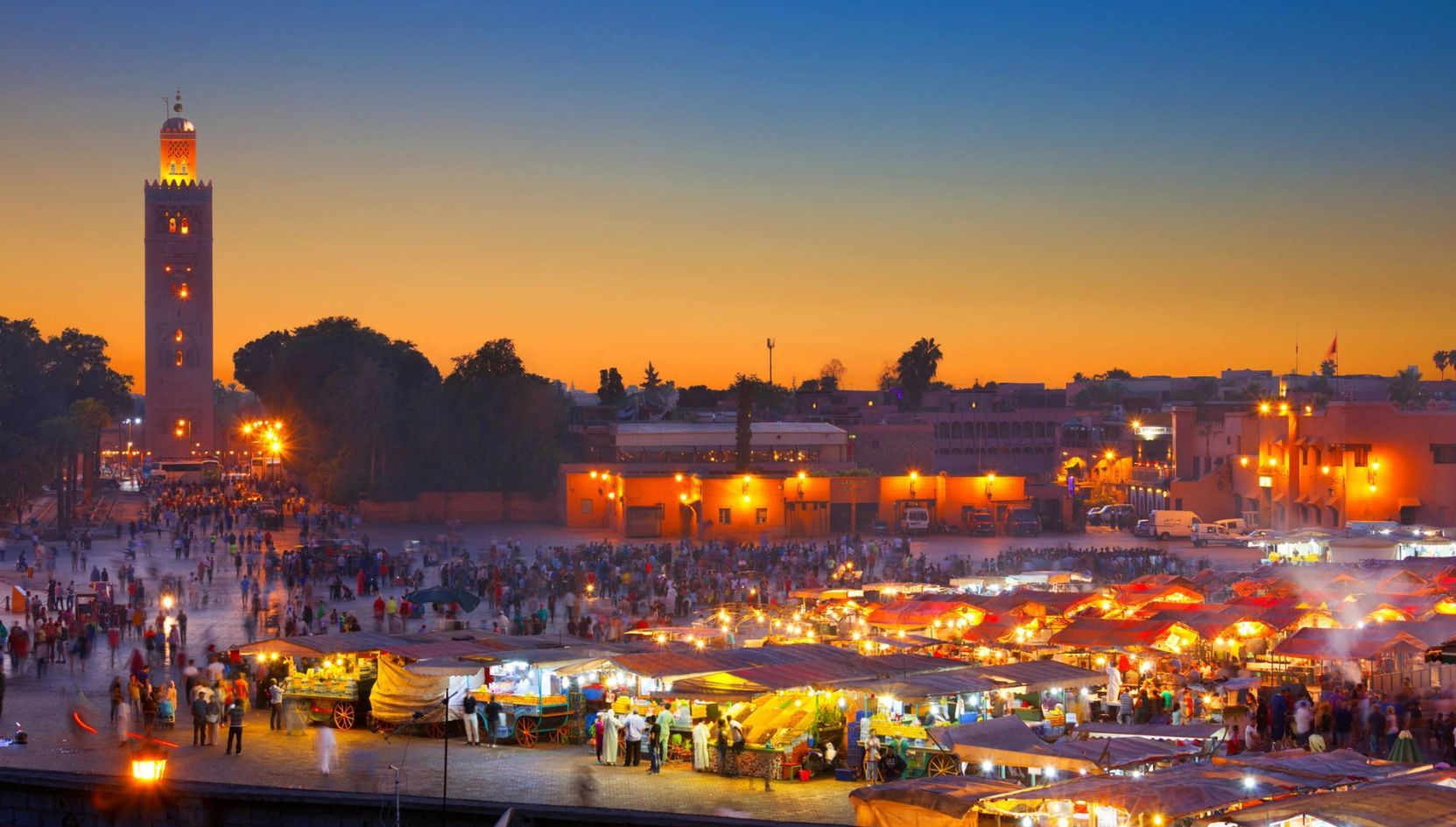 Sunset view of Jemaa el-Fnaa square and the Koutoubia Mosque in Marrakech, Morocco